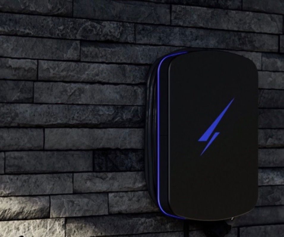 Smart EV charger installed on a slate-stone wall by Cruise Renewables